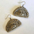andmade stone-textured ceramic pendant featuring the Taíno Moon Goddess petroglyph on a black cord necklace, inspired by ancient Puerto Rican indigenous rock art.